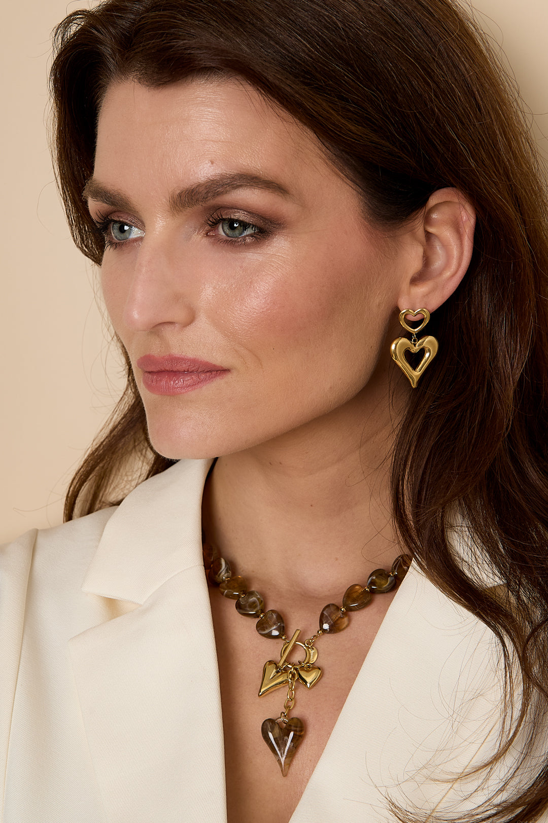 Bead necklace with hanging heart charms