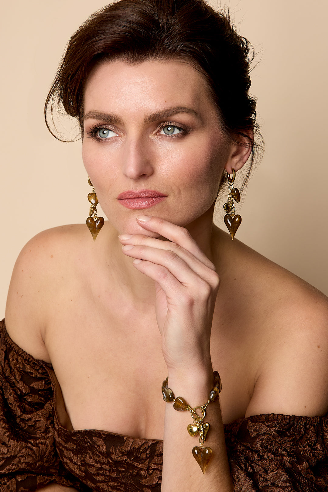 Beaded bracelet with hanging heart charms